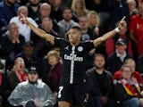 Kylian Mbappe celebrates his late goal during the Champions League group game between Liverpool and Paris Saint-Germain on September 18, 2018