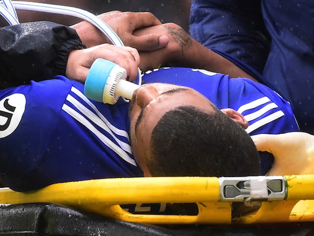Lee Peltier receives treatment during the Premier League game between Cardiff City and Manchester City on September 22, 2018
