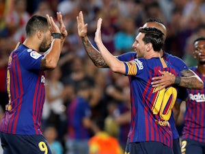 Barcelona forward Lionel Messi celebrates with teammates after scoring during his side's La Liga match against Girona on September 23, 2018