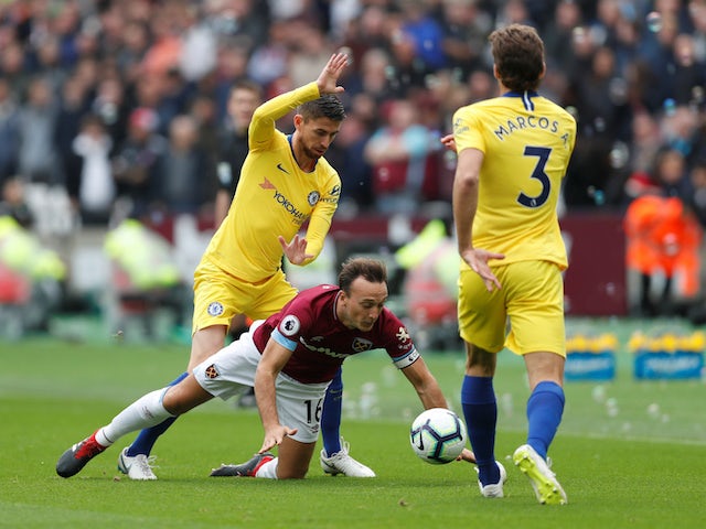 Mark Noble, Jorginho and Marcos Alonso in action during the Premier League game between West Ham United and Chelsea on September 23, 2018