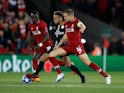 Neymar goes up against Sadio Mane and Jordan Henderson during the Champions League group game between Liverpool and Paris Saint-Germain on September 18, 2018