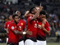 Manchester United midfielder Paul Pogba celebrates with teammate after scoring in his side's Champions League clash with Young Boys on September 19, 2018