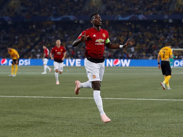 Manchester United midfielder Paul Pogba celebrates with teammate after scoring in his side's Champions League clash with Young Boys on September 19, 2018