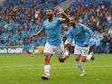 Sergio Aguero celebrates scoring during the Premier League game between Cardiff City and Manchester City on September 22, 2018