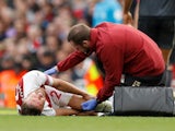 Shkodran Mustafi goes down injured during the Premier League game between Arsenal and Everton on September 23, 2018