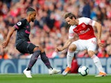 Theo Walcott and Nacho Monreal face off during the Premier League game between Arsenal and Everton on September 23, 2018