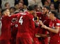 Daniel Sturridge is mobbed by his Liverpool teammates after equalising in the Premier League meeting with Chelsea on September 29, 2018