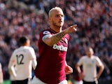 West Ham's Marko Arnautovic wheels away in celebration after scoring during his side's Premier League clash with Manchester United on September 29, 2018
