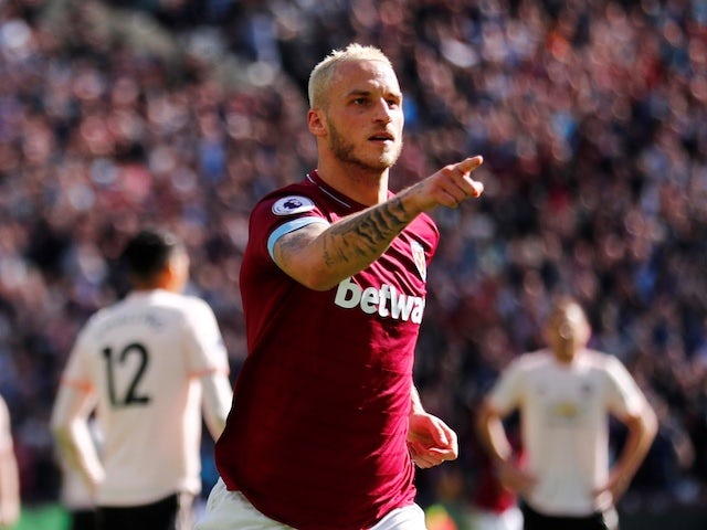 West Ham's Marko Arnautovic wheels away in celebration after scoring during his side's Premier League clash with Manchester United on September 29, 2018