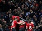 Manchester United players celebrate after scoring the winner against Newcastle United on October 6, 2018