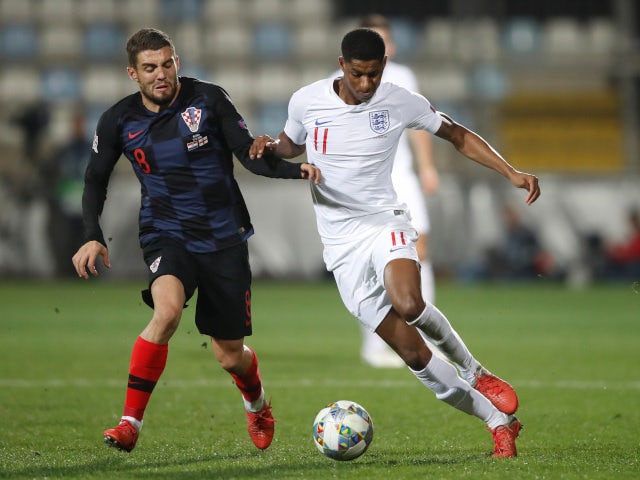 Marcus Rashford and Mateo Kovacic battle for the ball during England's goalless draw with Croatia on October 12, 2018