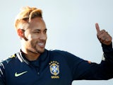 Neymar sticks a thumb up during a Brazil training session on October 9, 2018