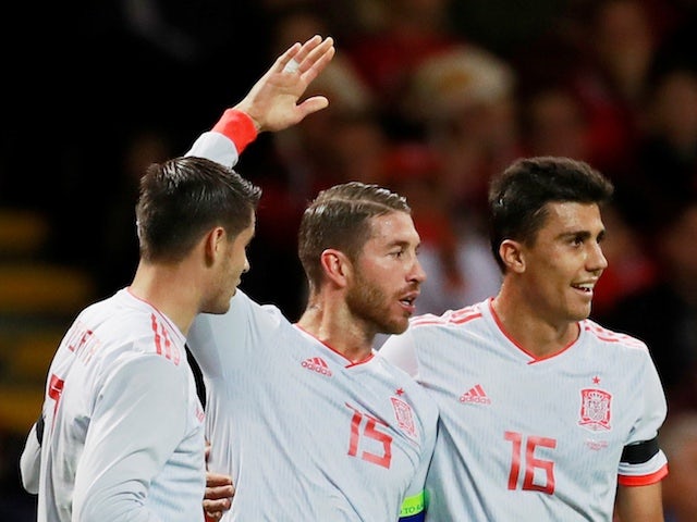 Spain captain Sergio Ramos celebrates with Rodri and Alvaro Morata after scoring during his side's international friendly with Wales on October 11, 2018