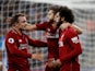 Mohamed Salah celebrates with Adam Lallana and Xherdan Shaqiri after opening the scoring in Liverpool's Premier League clash with Huddersfield on October 20, 2018