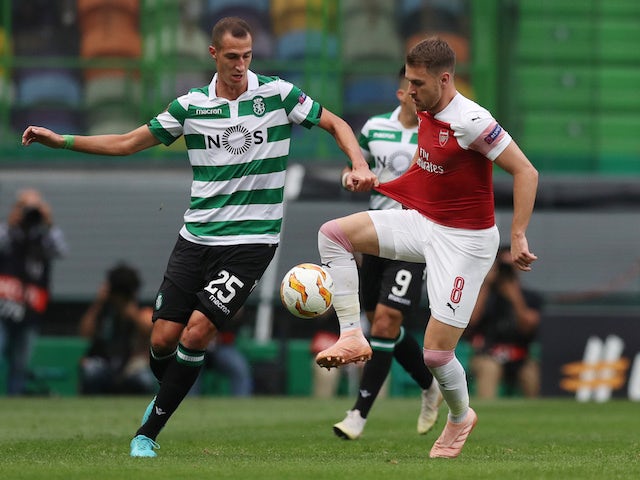 Radosav Petrovic and Aaron Ramsey in action during the Europa League group game between Sporting Lisbon and Arsenal on October 25, 2018
