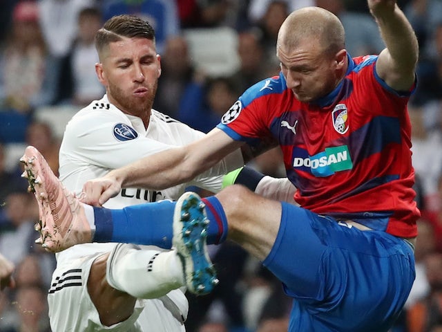 Sergio Ramos and Michael Krmencik in action during the Champions League group game between Real Madrid and Viktoria Plzen on October 23, 2018
