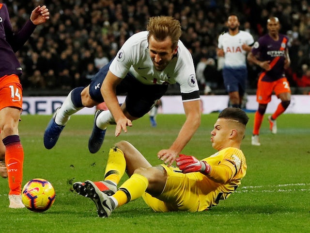 Harry Kane and Ederson in action during the Premier League game between Tottenham Hotspur and Manchester City on October 29, 2018