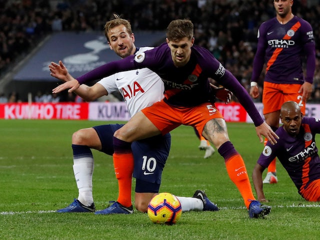 John Stones and Harry Kane in action during the Premier League game between Tottenham Hotspur and Manchester City on October 29, 2018