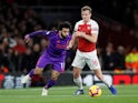 Mohamed Salah and Rob Holding in action during the Premier League game between Arsenal and Liverpool on November 3, 2018