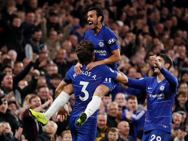 Pedro mounts Marcos Alonso after scoring during the Premier League game between Chelsea and Crystal Palace on November 4, 2018