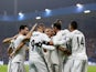 Real Madrid striker Karim Benzema celebrates with his teammates after scoring his second of the night against Viktoria Plzen on November 7, 2018