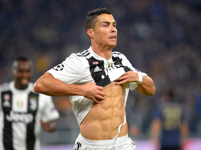 Cristiano Ronaldo flaunts his abs after scoring during the Champions League group game between Juventus and Manchester United on November 7, 2018