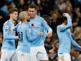 David Silva celebrates with his Manchester City teammates after giving his side the lead in the Manchester derby on November 11, 2018