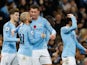 David Silva celebrates with his Manchester City teammates after giving his side the lead in the Manchester derby on November 11, 2018