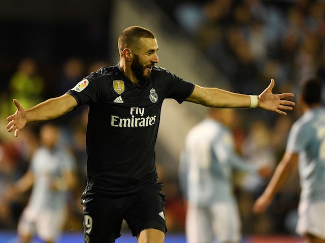 Real Madrid forward Karim Benzema celebrates scoring against Celta Vigo