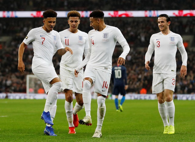 England's Jesse Lingard celebrates scoring with Jadon Sancho, Dele Alli and Ben Chilwell against the USA