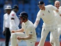 England's Keaton Jennings and Ben Stokes celebrate on November 17, 2018