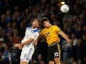 Wolverhampton Wanderers defender Leander Dendoncker challenges Leicester City's Christian Fuchs