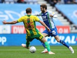 Wigan Athletic's Nick Powell takes on West Bromwich Albion's Craig Dawson on October 20, 2018