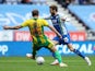 Wigan Athletic's Nick Powell takes on West Bromwich Albion's Craig Dawson on October 20, 2018