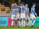 Huddersfield Town midfielder Aaron Mooy celebrates with teammates after scoring against Wolverhampton Wanderers on November 25, 2018