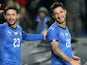 Matteo Politano celebrates scoring for Italy with teammate Stefano Sensi on November 20, 2018