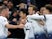 Son Heung-min is mobbed by his Tottenham Hotspur teammates after adding his name to the scoresheet against Chelsea on November 24, 2018
