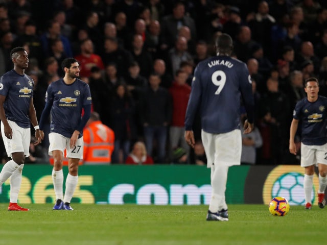 Manchester United's players look dejected after conceding the opening goal to Southampton on December 1, 2018