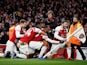 Alexandre Lacazette celebrates Arsenal's crucial third goal with his teammates in the 4-2 win over Tottenham Hotspur on December 2, 2018