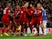 Divock Origi is mobbed by his Liverpool teammates after his dramatic winner against Everton on December 2, 2018