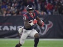 Houston Texans running back Alfred Blue carries the ball in the fourth quarter against the Tennessee Titans at NRG Stadium