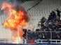 A petrol bomb explodes during the Champions League clash with AEK Athens and Ajax on November 27, 2018