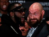 Deontay Wilder and Tyson Fury square up at a press conference on November 28, 2018