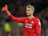 Jonas Lossl sticks a thumb up during the Premier League game between Huddersfield Town and Brighton & Hove Albion on December 1, 2018