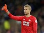 Jonas Lossl sticks a thumb up during the Premier League game between Huddersfield Town and Brighton & Hove Albion on December 1, 2018
