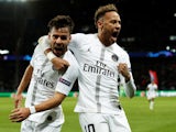 Paris Saint-Germain's Juan Bernat celebrates with Neymar after scoring against Liverpool on November 28, 2018