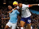 Raheem Sterling and Tyrone Mings in action during the Premier League game between Manchester City and Bournemouth on December 1, 2018