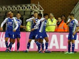 Wigan Athletic players celebrate after scoring against Blackburn Rovers on November 28, 2018