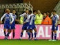 Wigan Athletic players celebrate after scoring against Blackburn Rovers on November 28, 2018