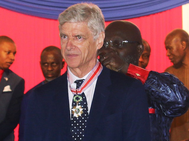 Arsene Wenger picks up an award in Liberia on August 24, 2018
